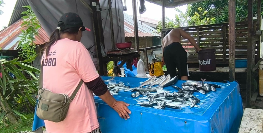 woman buying fish