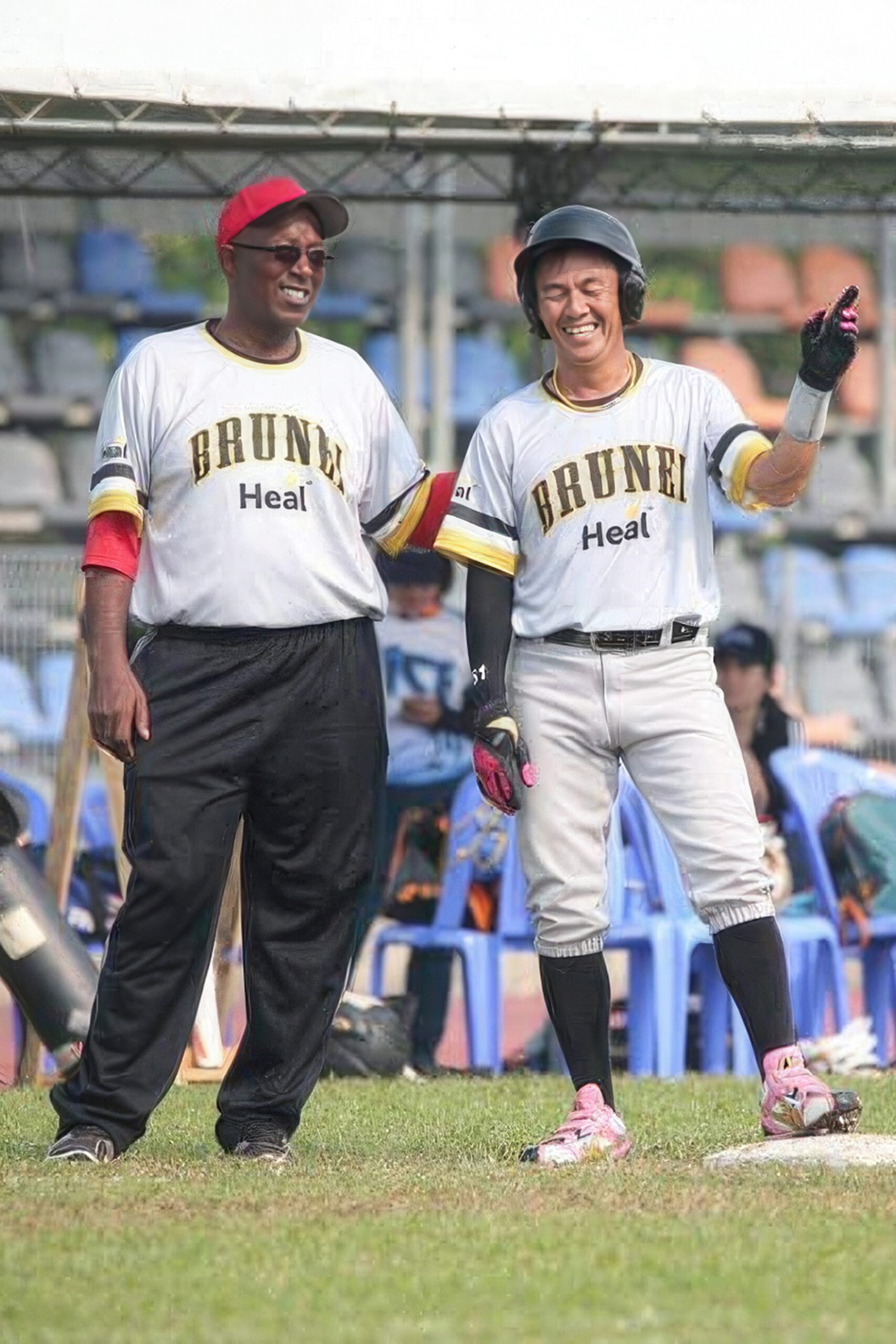 Coach Merv coaching third base in Brunei
